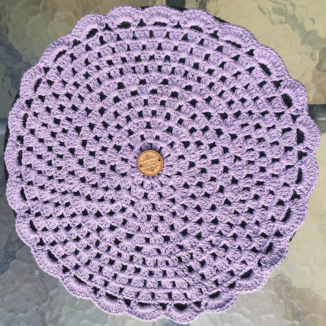 Delicate and elegant lilac crochet sousplat for the table.