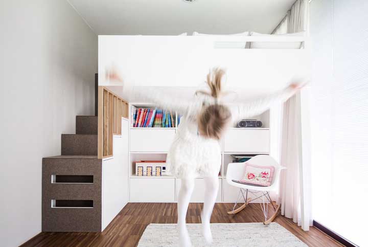 In this female single room, the furniture was solved in a single wall leaving the rest of the room free