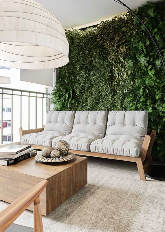 Here, the vertical garden highlights the neutral tone sofa