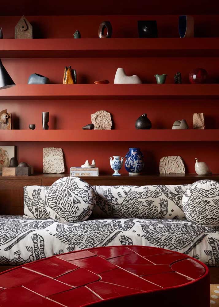 Room with bookcase and red coffee table. Notice that the tones, although different, harmonize