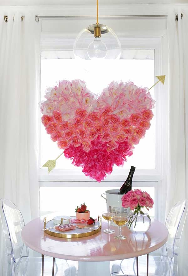 Arrangement with flowers hanging from heart-shaped plate