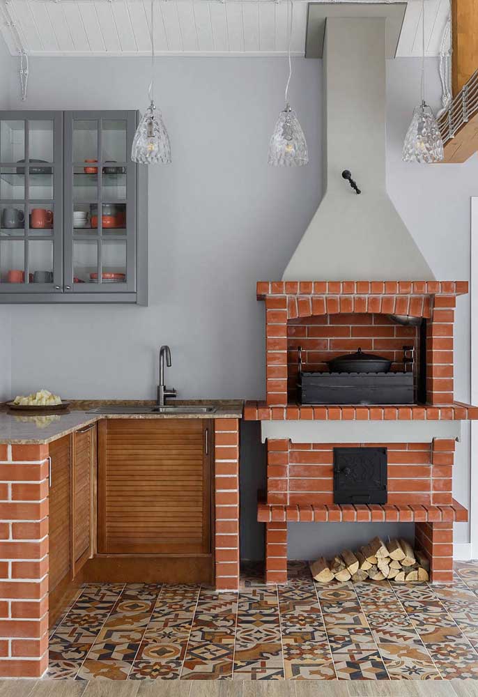 Gourmet space with exposed brick barbecue and masonry chimney