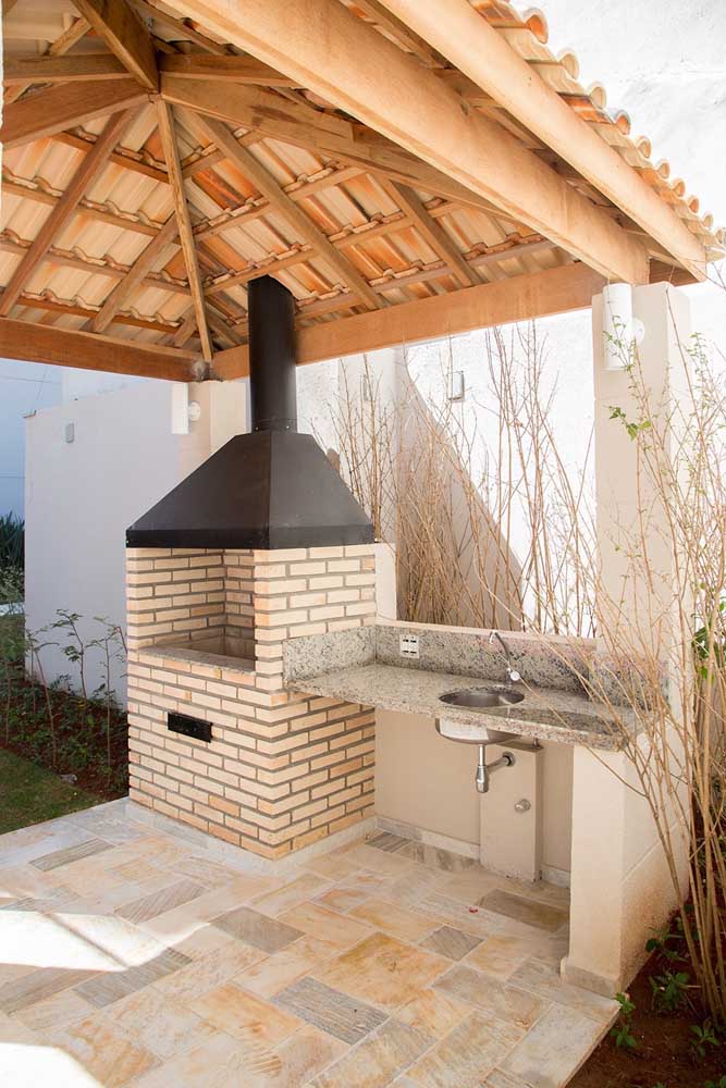 Brick barbecue with iron chimney