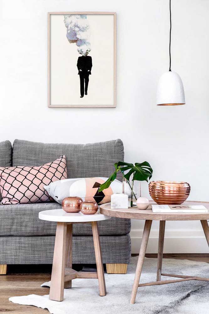 Scandinavian style living room with beautiful copper details on the inside of the lamp and copper vases