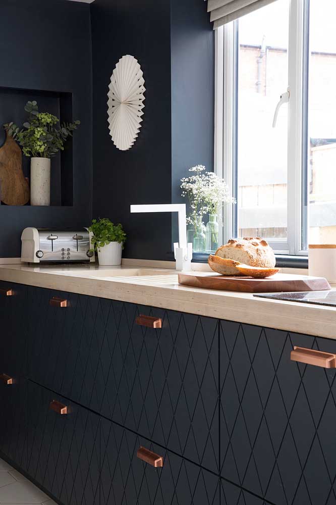 Copper stood out in the handles of this kitchen's planned cabinets