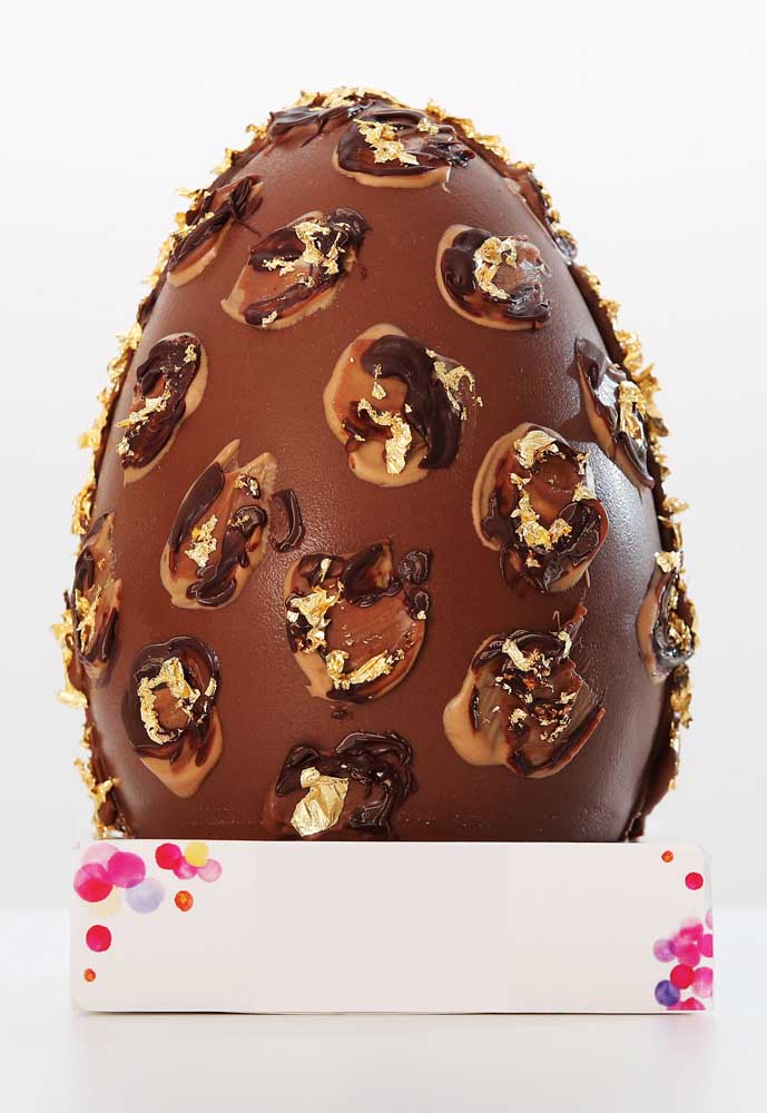 Easter egg decorated with mixed chocolates