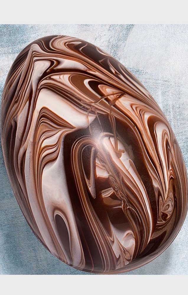 A wooden sculpture? No, they are Easter eggs with drawing work in chocolate, similar to carved wood