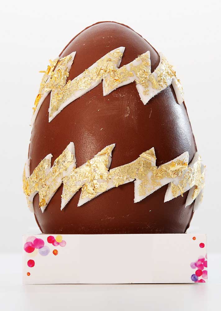 Simple milk chocolate Easter egg with white chocolate details