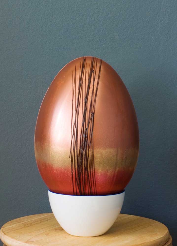 Easter egg printed and decorated in copper tones