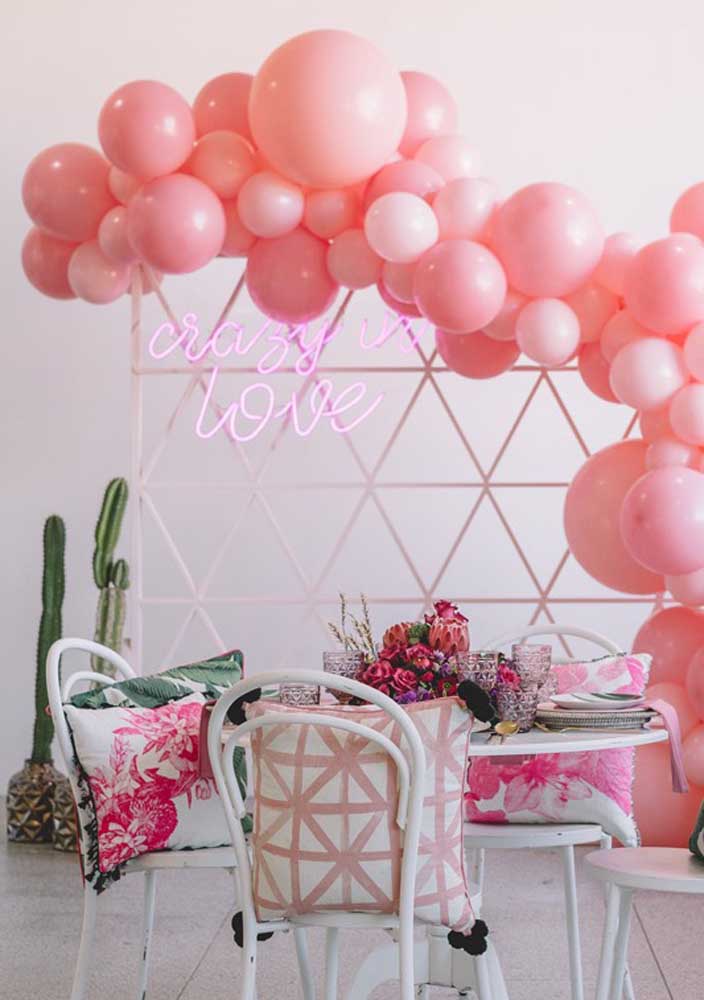 Pink neon sign matching party balloons