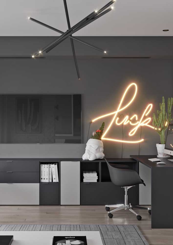 In the gray living room, the neon sign shines absolute