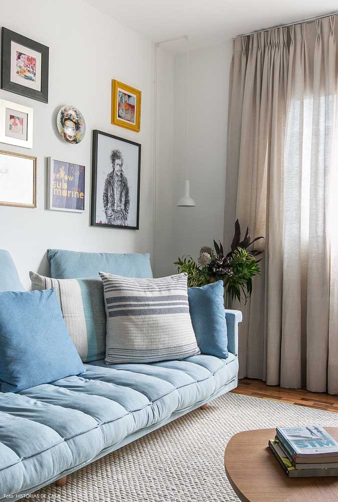 Pillows in neutral tones kept company for this light blue sofa