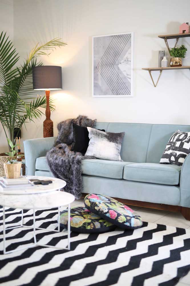 The Scandinavian-influenced living room welcomed the light blue sofa