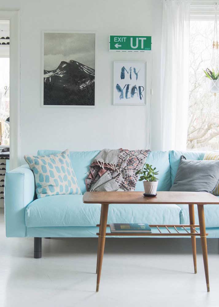 Light blue sofa with cushions for a light and inviting living room