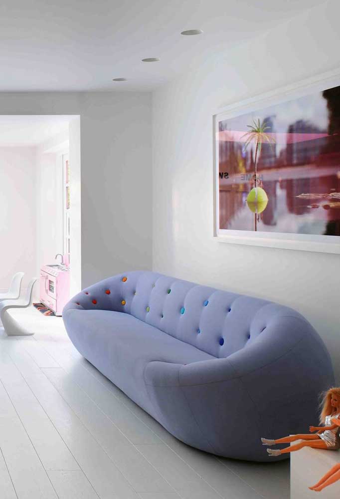 Clean and very inviting environment with light blue sofa and pillows in different shades of blue