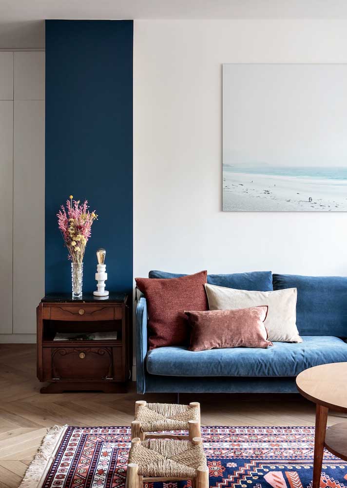 The blue sofa complemented the other shades of blue that make up the room