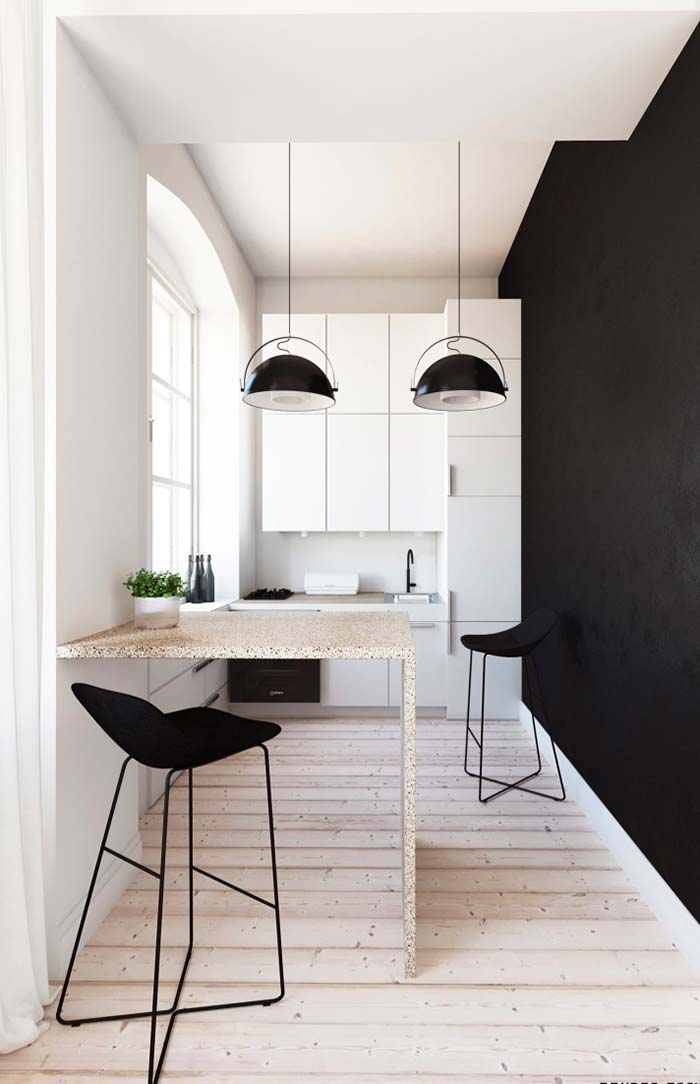 Black wall in black and white kitchen