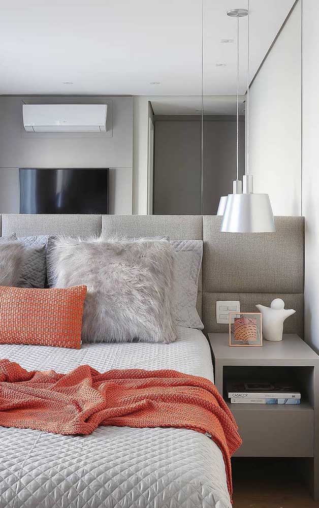 The mirror on the headboard wall helps to visually enlarge the double bedroom