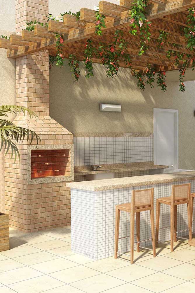 Brick barbecue built in gourmet space with special emphasis on the pergola