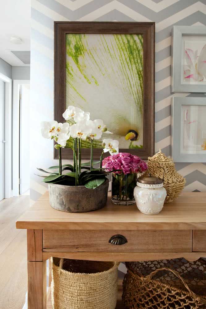 The sideboard is a great piece of furniture to receive the white orchid