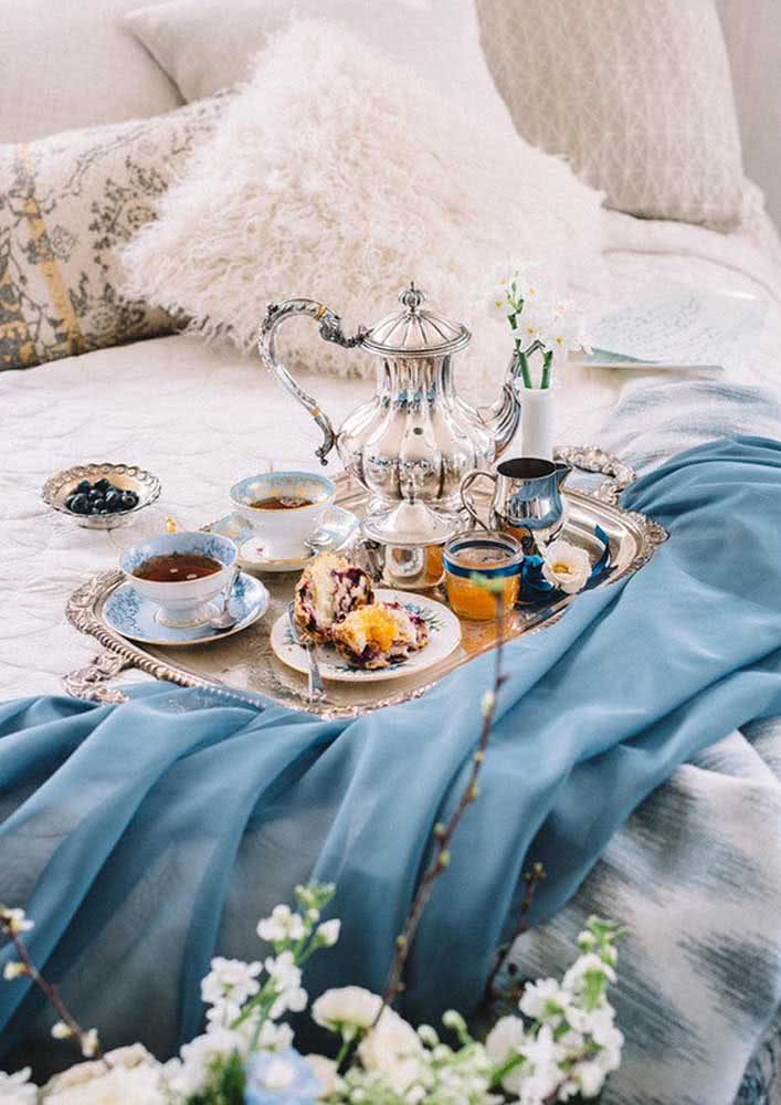 Breakfast in luxury bed with silver tray and teapot
