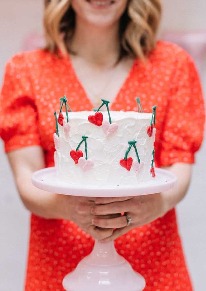 Simple cherry cake decorated with whipped cream