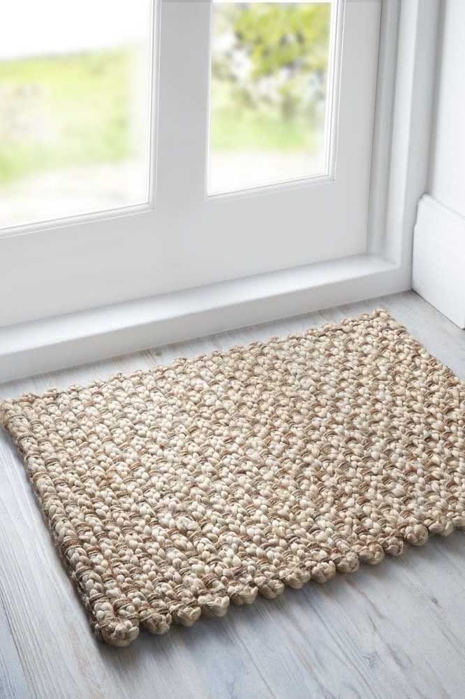 The rustic touch is the highlight of this small crochet door mat