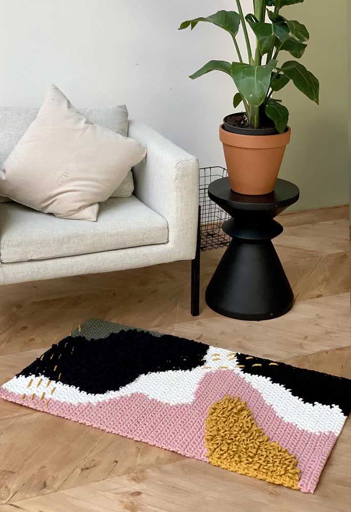 Rectangular crochet mat with a variety of colors and textures