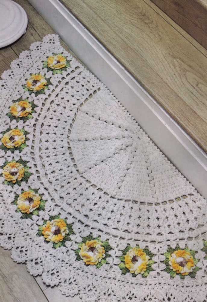 Get inspired with this crochet door mat with flowers